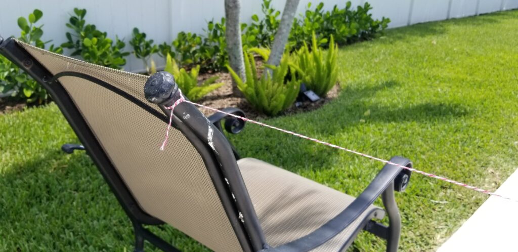 string tied to top part of chair