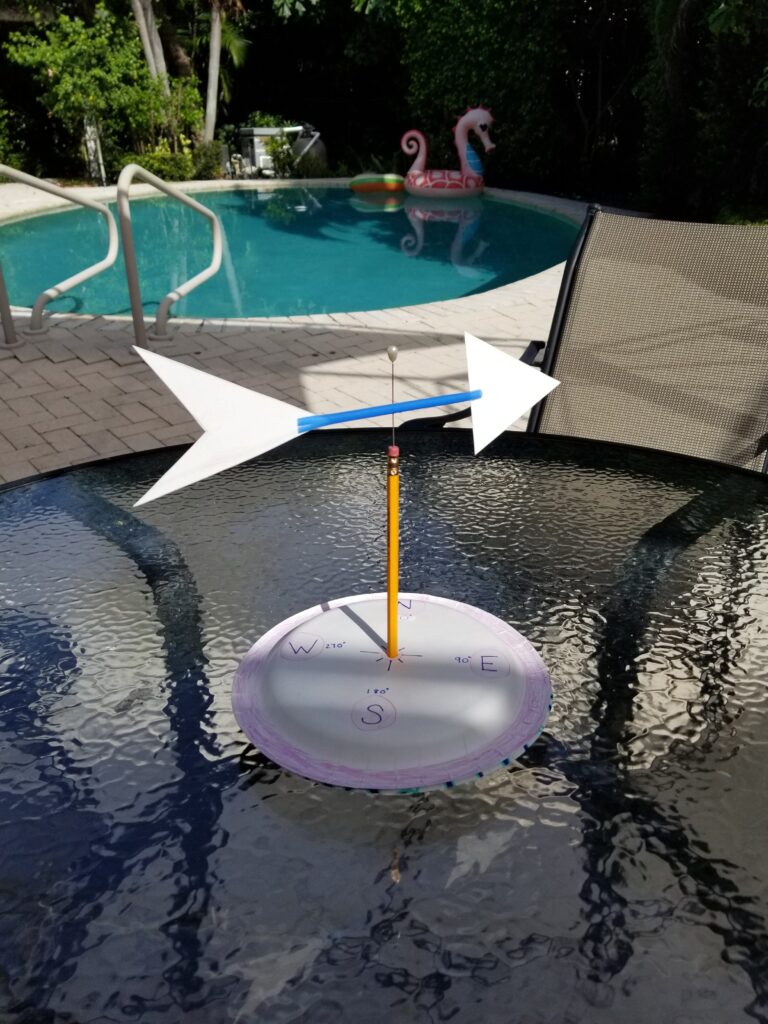 homemade wind vane on outside table