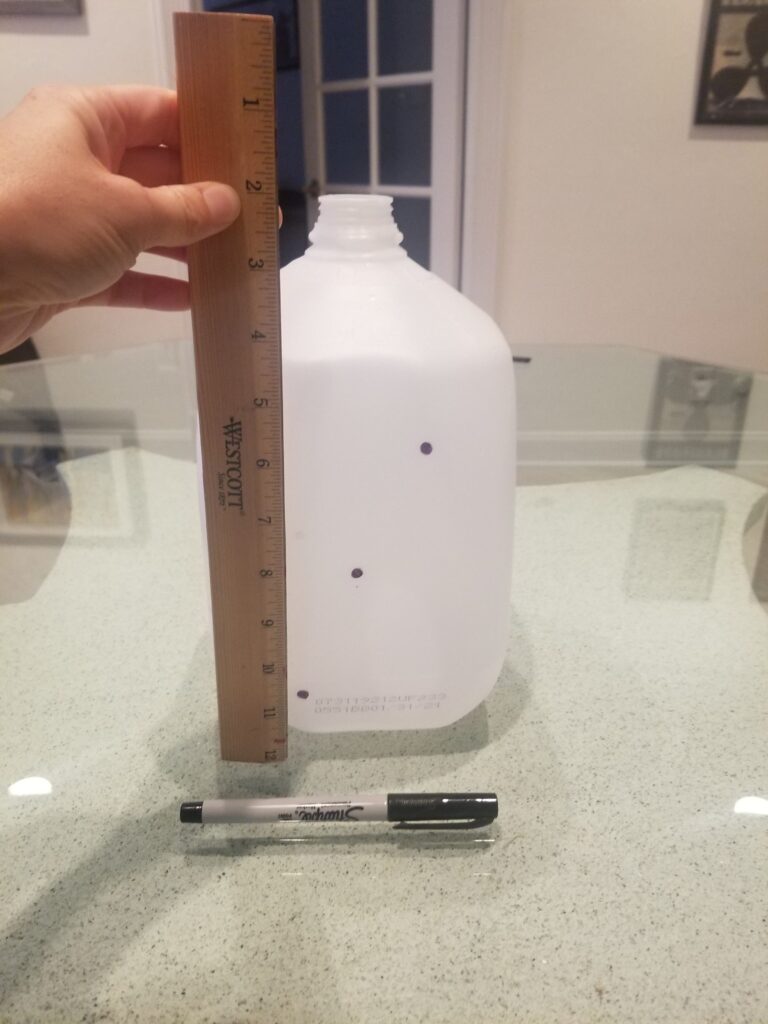 measuring marks on empty milk jug