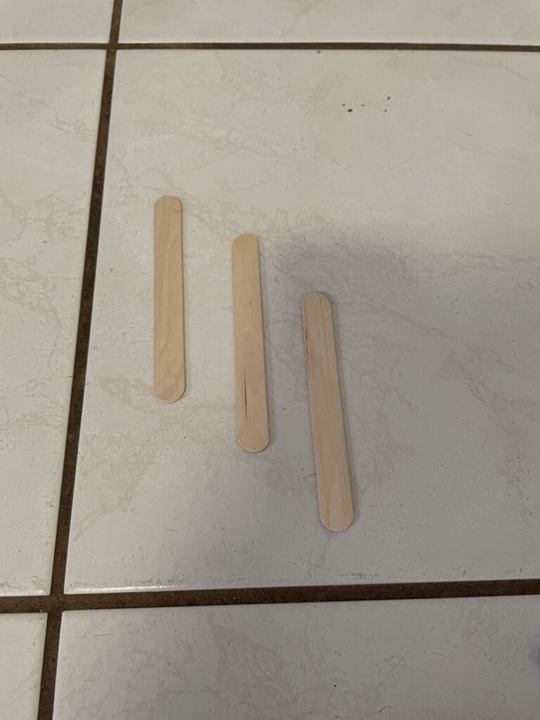 Three popsicle sticks