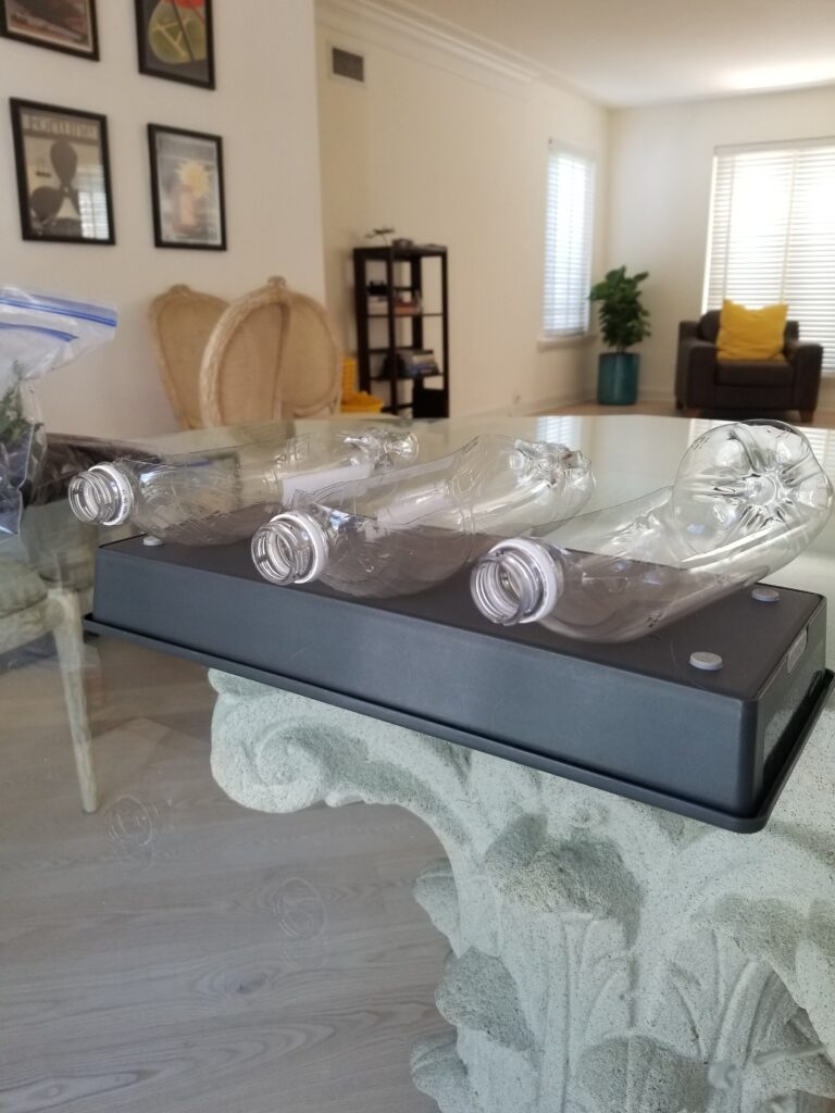 cut plastic bottles raised on a table