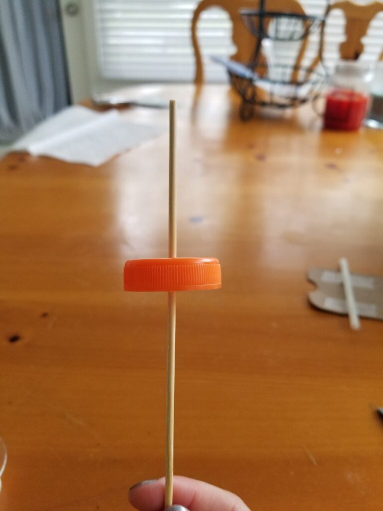 dowel through the cap