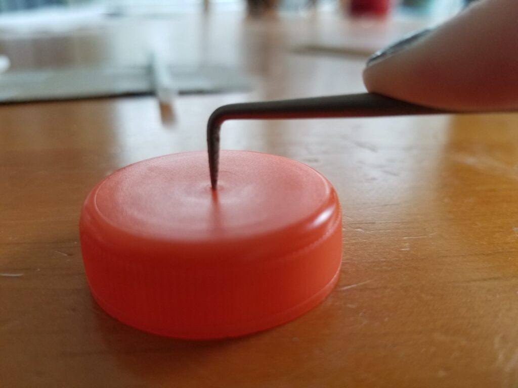 drill a hole in the cap