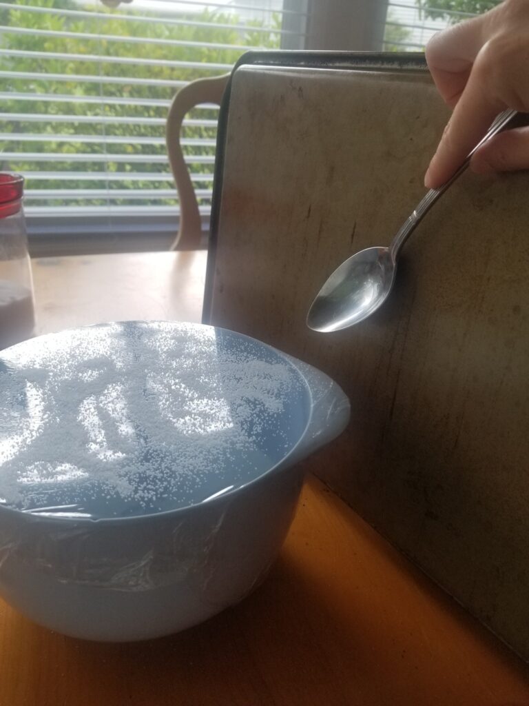 hitting pan next to bowl