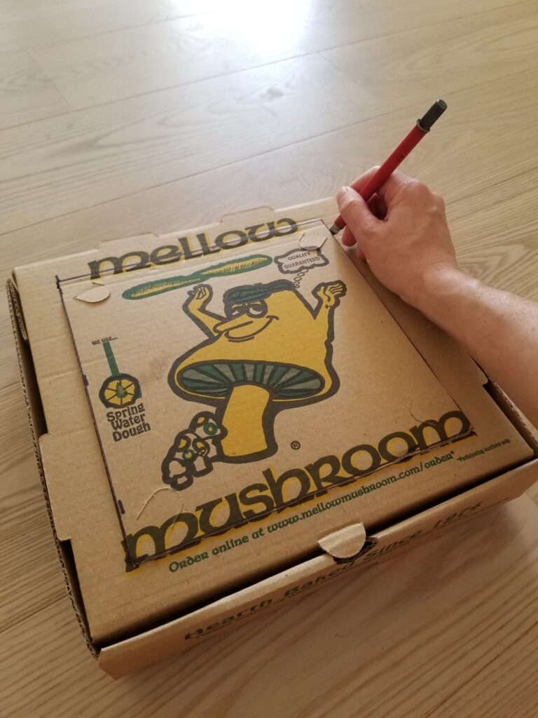 pizza box being cut